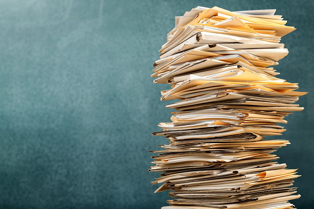 Stack file folders with documents on background